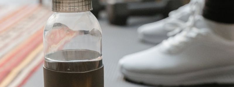 Detailed view of a fitness mat and water bottle